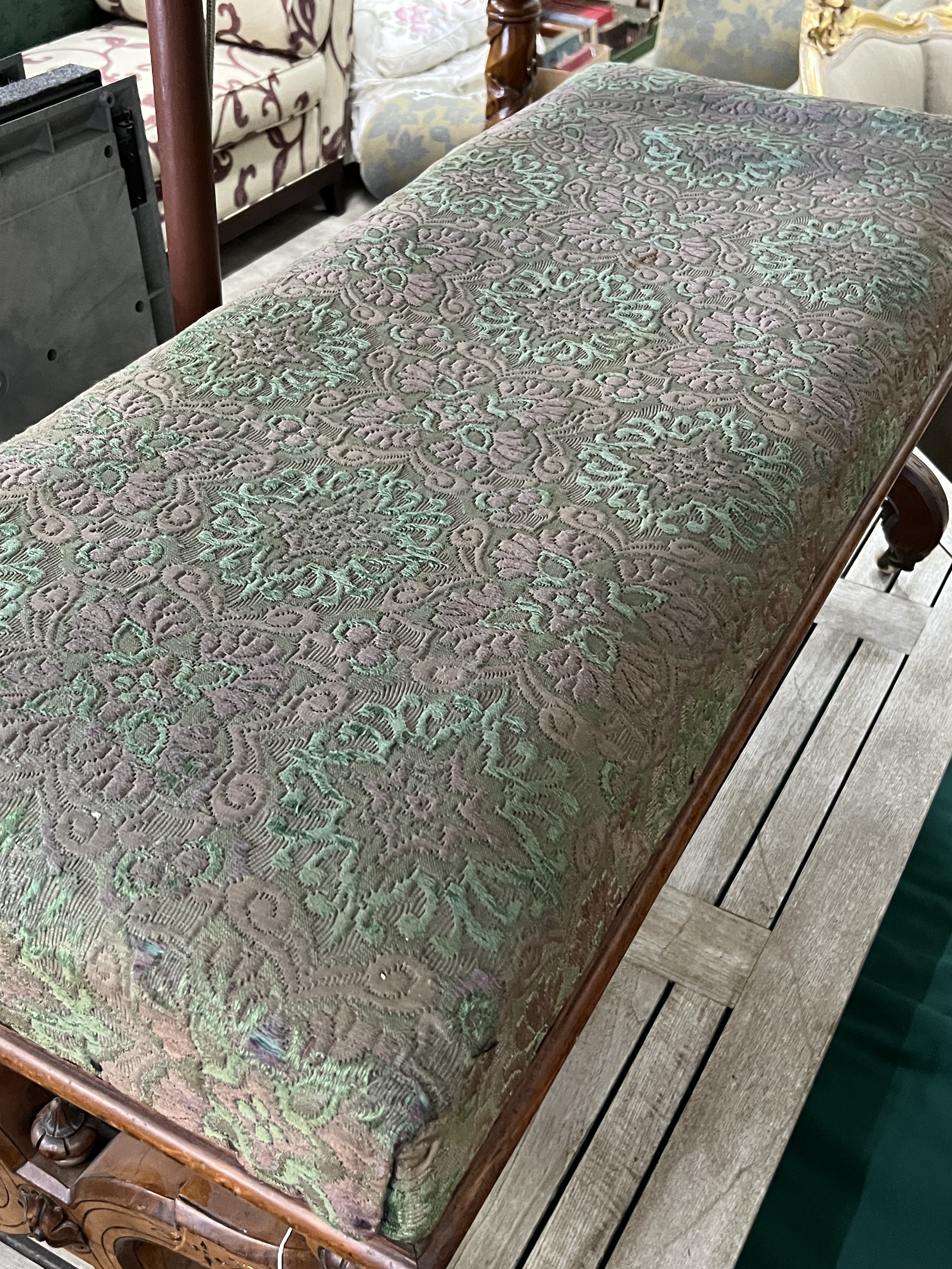 A late Victorian Aesthetic movement walnut X frame window seat, width 115cm, depth 48cm, height 50cm